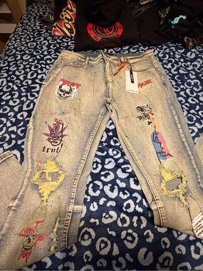 Light Blue Distressed Skinny Jeans with Multicolor Graphic Patches